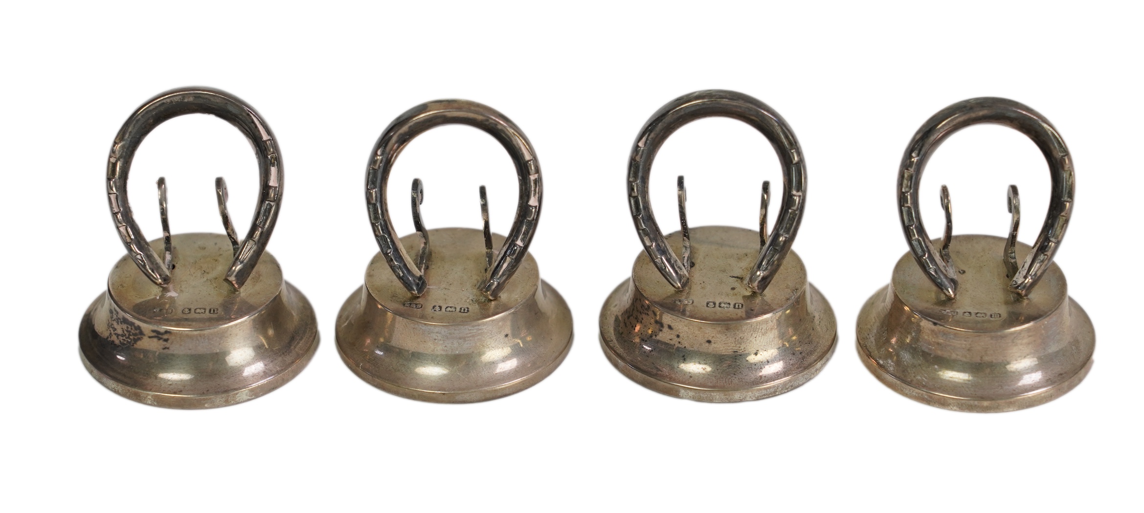 A cased set of four Edwardian silver horseshoe menu holders, by Levi & Salaman